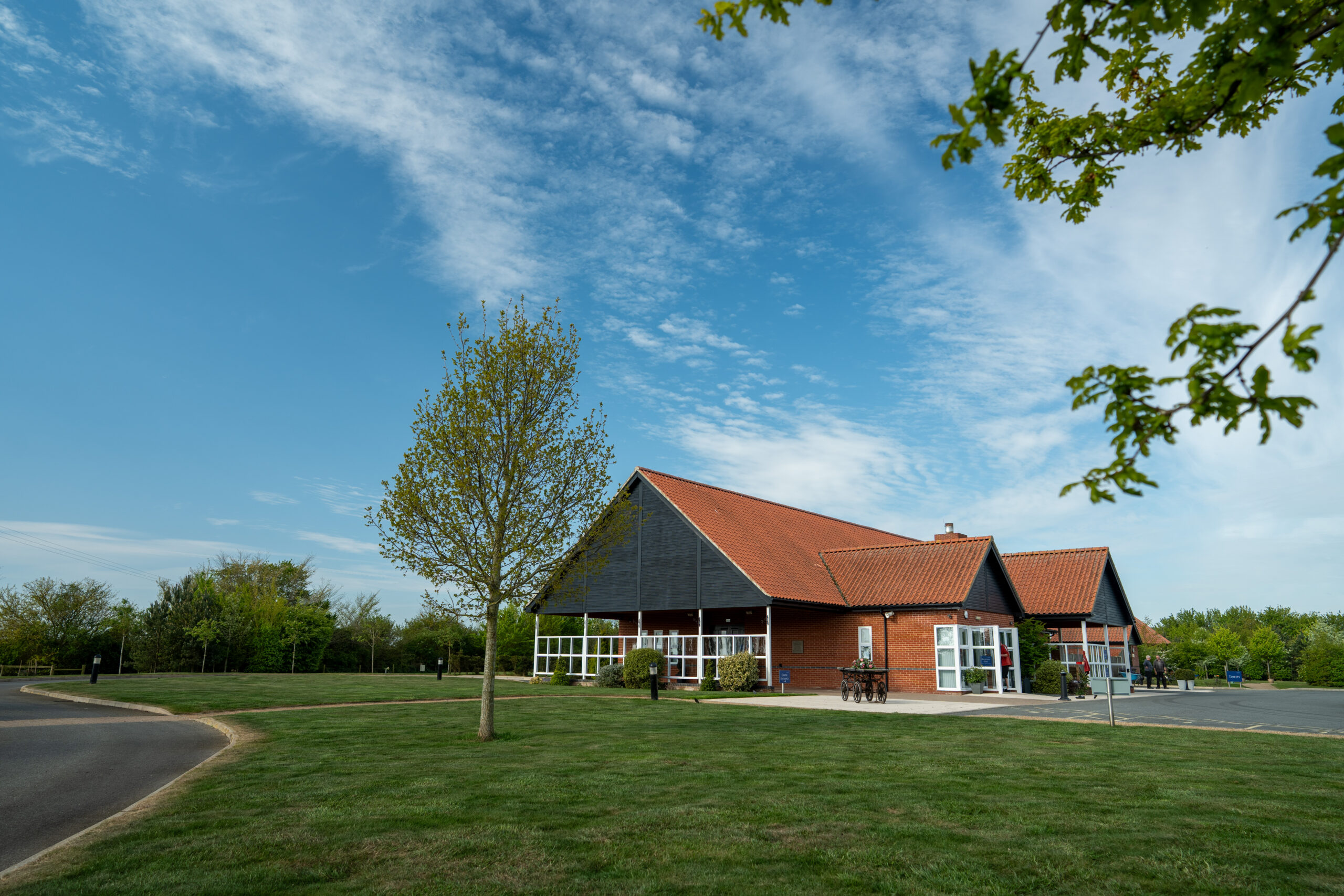 Exterior of Waveney Memorial Park crematorium building with red tiled roof